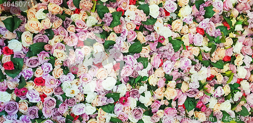 Image of Colorful artificial roses as a background