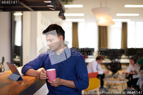 Image of casual indian business man taking break from the work