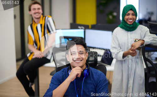 Image of Multiethnic startup business team with Arabian woman