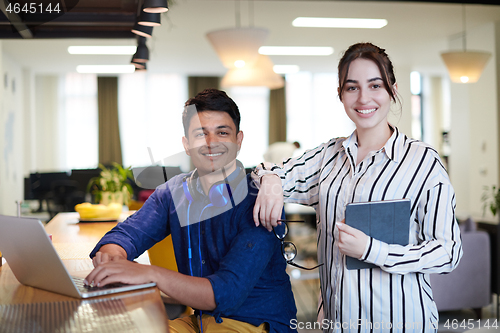 Image of Business people In Relaxation Area Of Modern Office