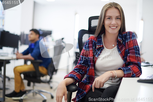 Image of casual business woman working on desktop computer