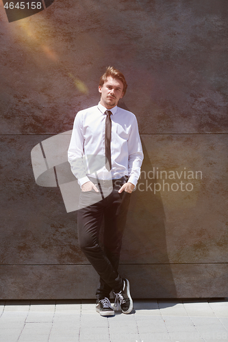 Image of portrait of startup businessman in a white shirt with a tie