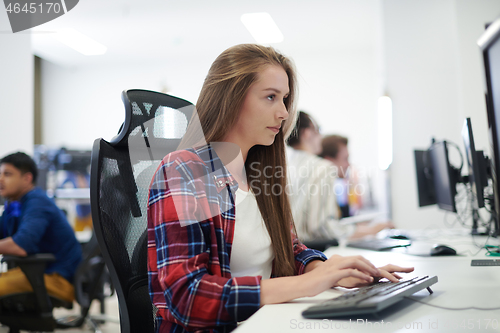 Image of casual business woman working on desktop computer