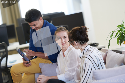 Image of Business people Working In Relaxation Area Of Modern Office