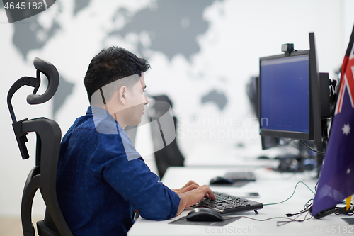 Image of casual indian business man working on desktop computer