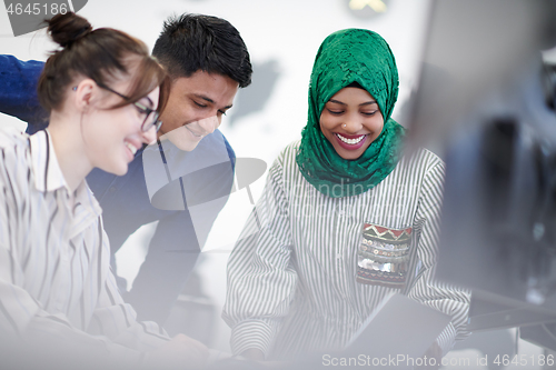 Image of Multiethnic startup business team with Arabian woman