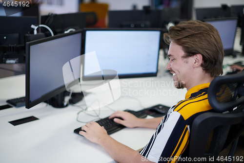 Image of casual business man working on desktop computer