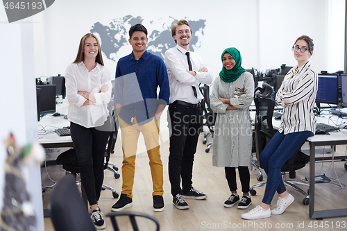 Image of portrait of young excited multiethnics business team