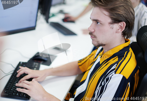 Image of casual business man working on desktop computer