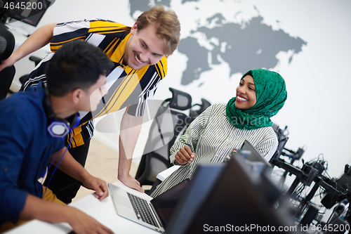Image of Multiethnic startup business team with Arabian woman