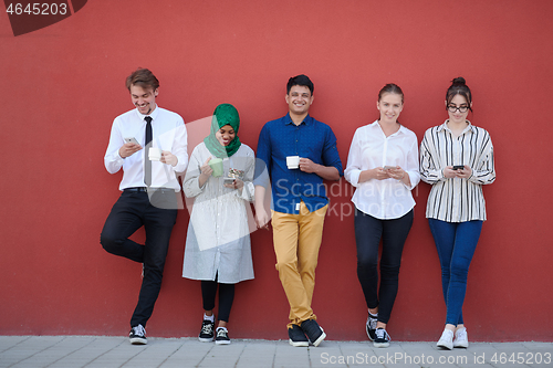 Image of multiethnic group of casual business people during coffee break