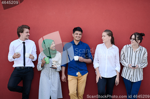 Image of multiethnic group of casual business people during coffee break