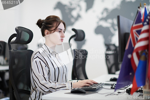 Image of casual business woman working on desktop computer