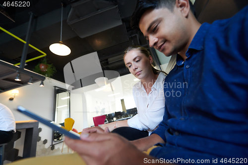 Image of Business people Working In Relaxation Area Of Modern Office