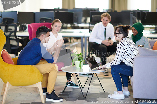 Image of Multiethnic startup business team having team building