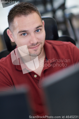 Image of casual business man working on desktop computer