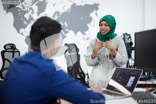 Image of Multiethnic startup business team with Arabian woman