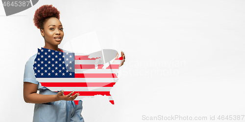 Image of Beautiful african-american doctor cares about USA isolated over white studio background