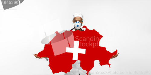 Image of Beautiful african-american doctor cares about Switzerland isolated over white studio background