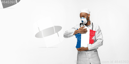 Image of Beautiful african-american doctor cares about France isolated over white studio background