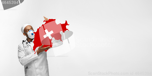 Image of Beautiful african-american doctor cares about Switzerland isolated over white studio background