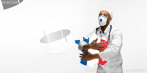 Image of Beautiful african-american doctor cares about France isolated over white studio background