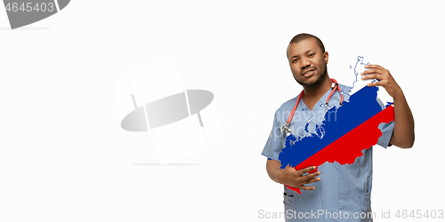 Image of Beautiful african-american doctor cares about Russia isolated over white studio background