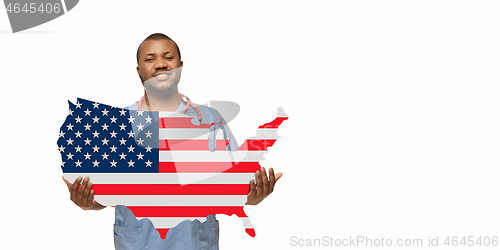 Image of Beautiful african-american doctor cares about USA isolated over white studio background