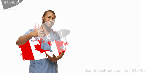 Image of Beautiful african-american doctor cares about Canada isolated over white studio background