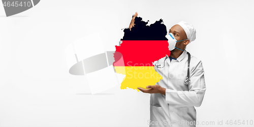 Image of Beautiful african-american doctor cares about Germany isolated over white studio background