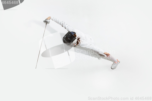 Image of Teen girl in fencing costume with sword in hand isolated on white background, top view