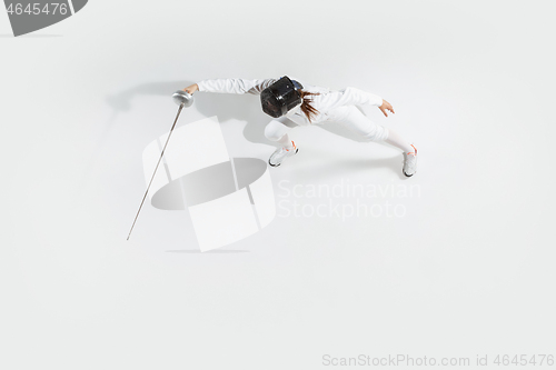 Image of Teen girl in fencing costume with sword in hand isolated on white background, top view