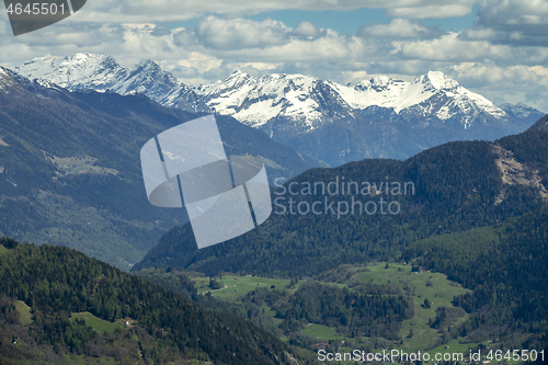 Image of high mountains and valley with village