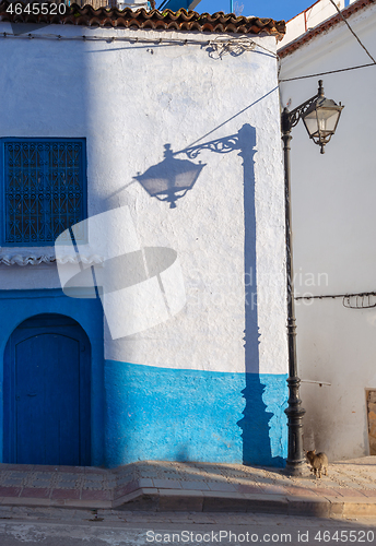 Image of Lantern and its shadow on blue street