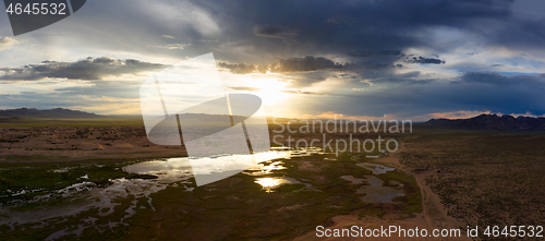 Image of Sand dunes Bayan Gobi and lake at sunset