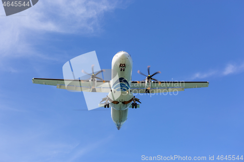 Image of Passenger propeller airplane before landing