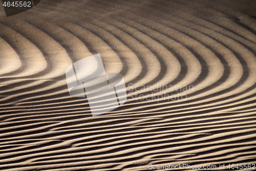 Image of Wind blowing over sand dunes