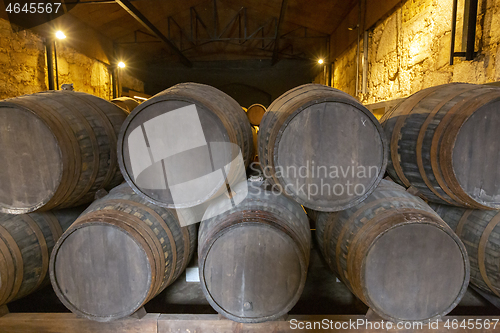 Image of barrel filled with port wine in wine cellar