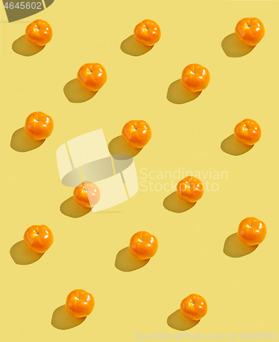 Image of yellow tomatoes on yellow background