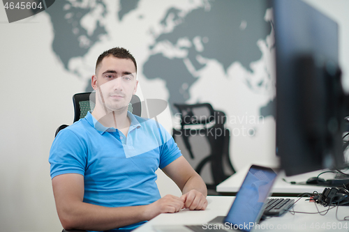 Image of casual business man working on desktop computer