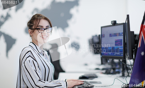 Image of casual business woman working on desktop computer