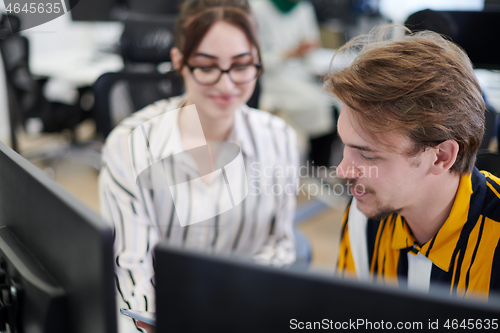 Image of business couple working together on project