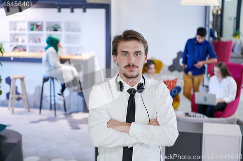 Image of portrait of successful businessman  in startup office