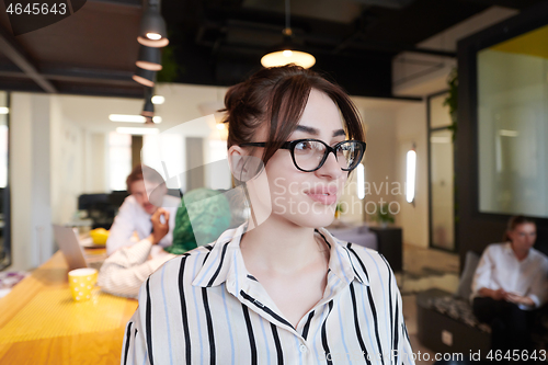 Image of portrait of businesswoman with glasses