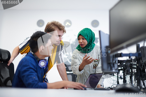 Image of Multiethnic startup business team with Arabian woman