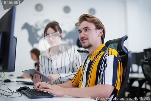 Image of business couple working together on project