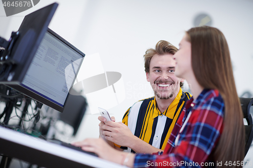 Image of business couple working together on project