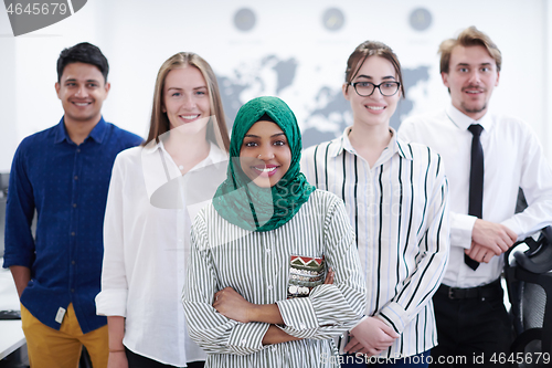 Image of portrait of young excited multiethnics business team