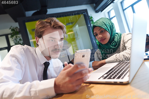 Image of international multicultural business team working together