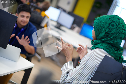 Image of Multiethnic startup business team with Arabian woman
